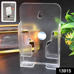 Mobile phone stand mounted on a wall in a modern living space, holding a smartphone.
