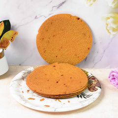 Close-up shot of a thin, crunchy Maniarr's Bajri Khakhra, perfect for snacking.