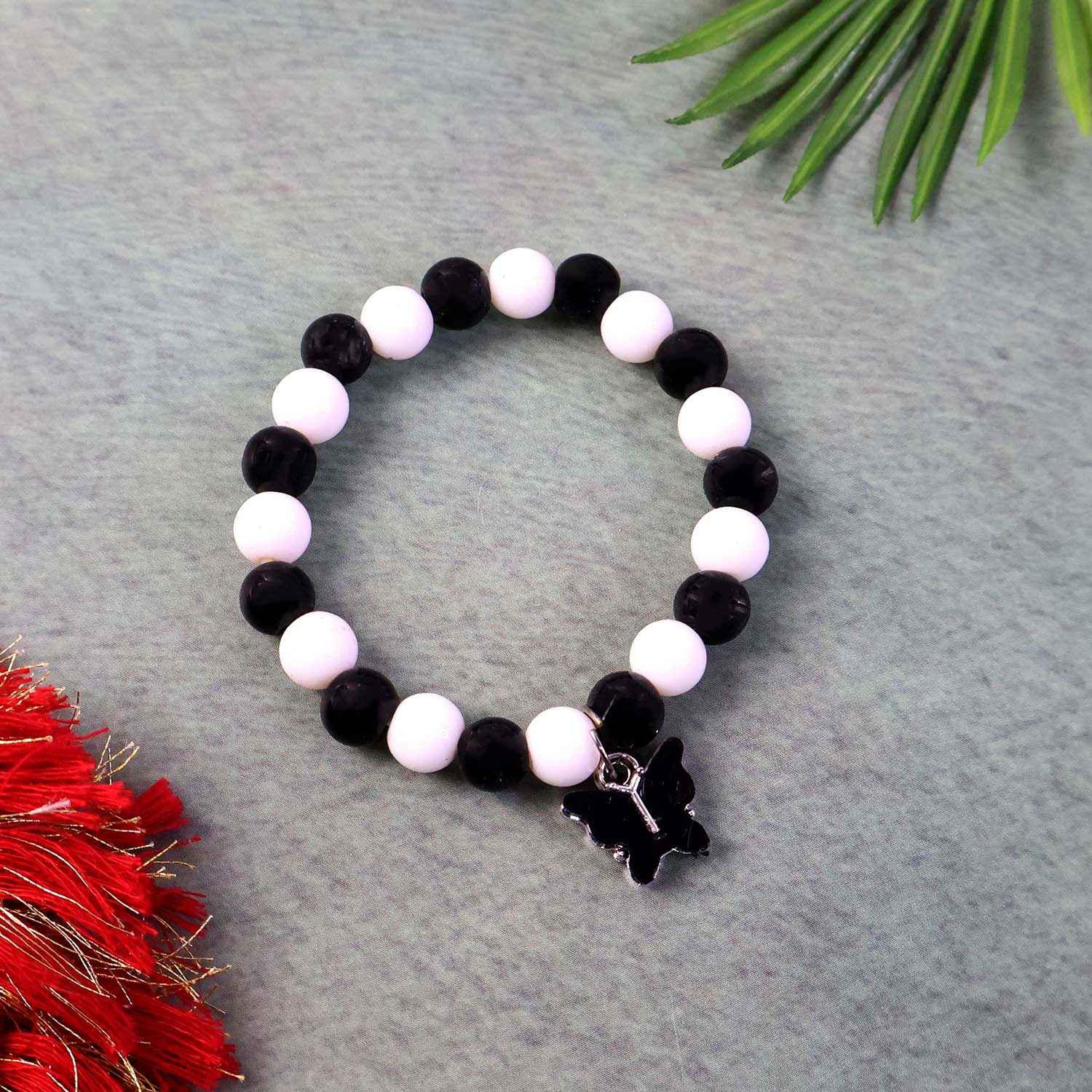 Black & White Beaded Bracelet with Cross Pendant – Elegant Style