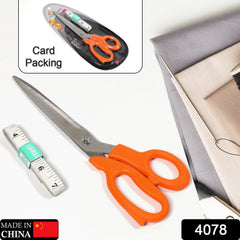 Close-up of ergonomic handles on tailor scissors, designed for comfortable grip during sewing.