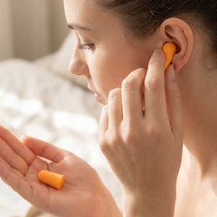 Four pairs of multi-colored soft foam earplugs for effective noise reduction