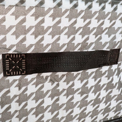 Detail shot of the canvas storage basket showing its reinforced steel support structure for durability.