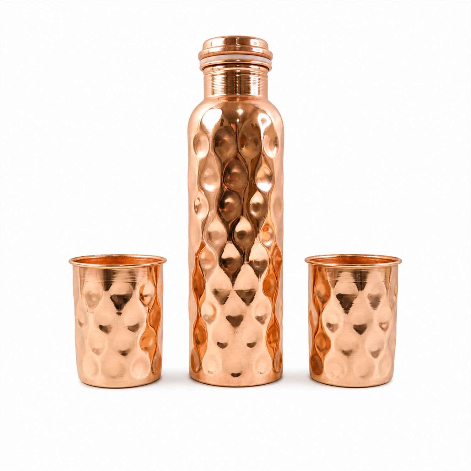 Detailed view of the sleek design and polished finish of the copper drinking glasses.