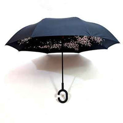 Durable windproof reverse umbrella with reinforced ribs, standing strong against elements.