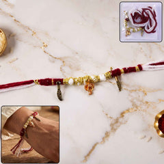 Rakhi Bracelet Ð Ethnic design with Ganesh charm and feather accents