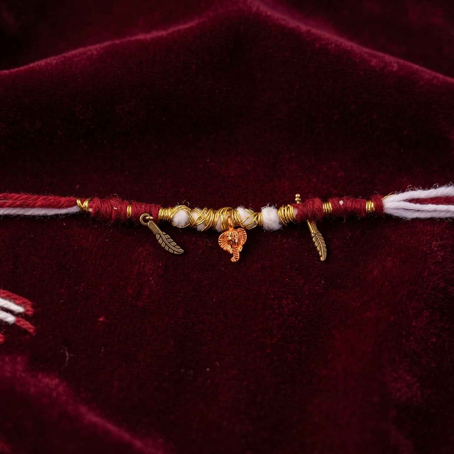 Rakhi Bracelet Ð Ethnic design with Ganesh charm and feather accents