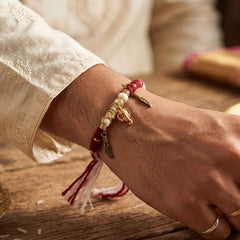 Rakhi Bracelet Ð Ethnic design with Ganesh charm and feather accents