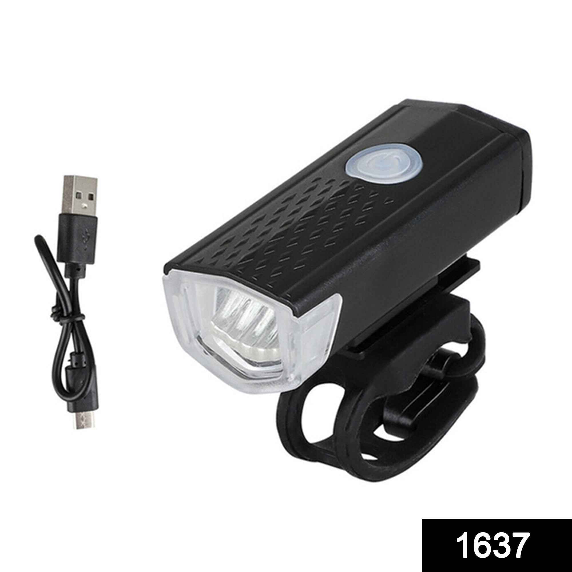 Bright front bike light illuminating a dark path.