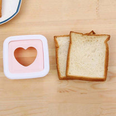 Bread slice with heart shape cut made by sandwich cutter
