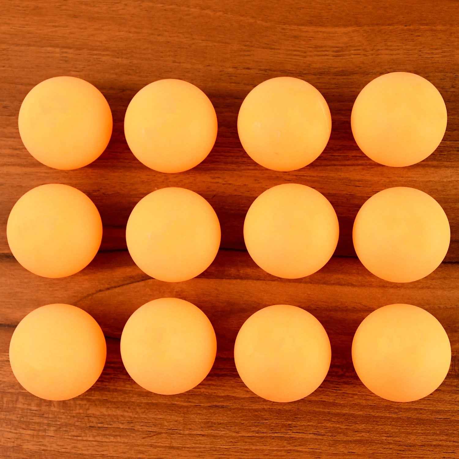 Orange table tennis balls ideal for training and tournament use displayed