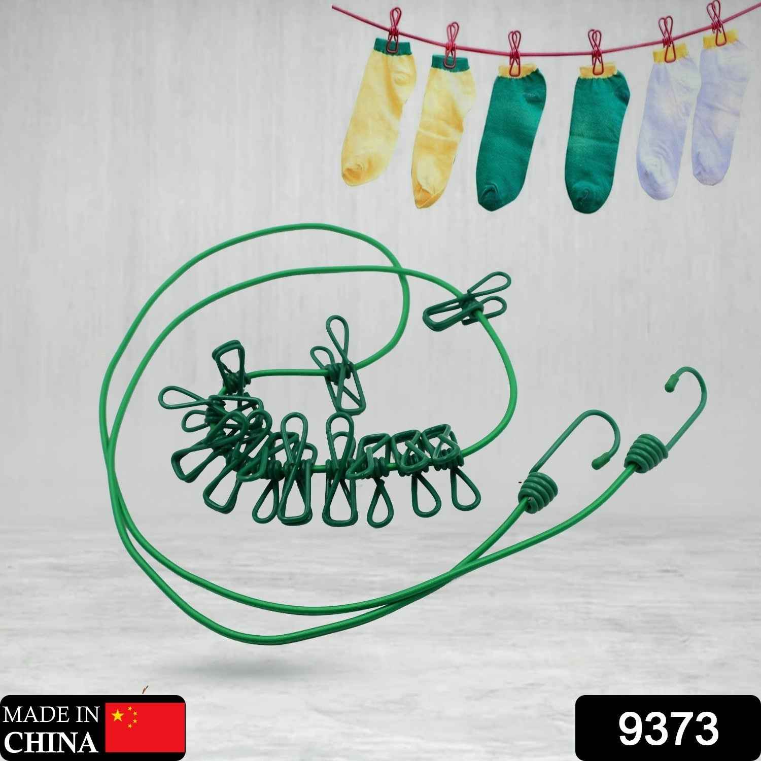 FERVENT portable clothes drying rope stretched out, holding various garments.
