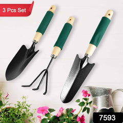 Close-up of the durable steel heads and ergonomic wooden handles of the gardening tools.