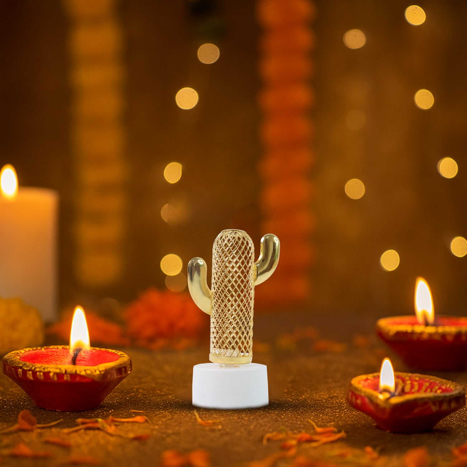 Single cactus shaped flameless LED candle detail with golden pattern