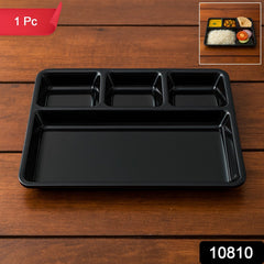 Black plastic 4-section rectangular meal tray with raised edges to prevent spills.