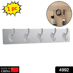 Close-up of a clear heavy-duty adhesive hook, showcasing its strong, minimalist design.