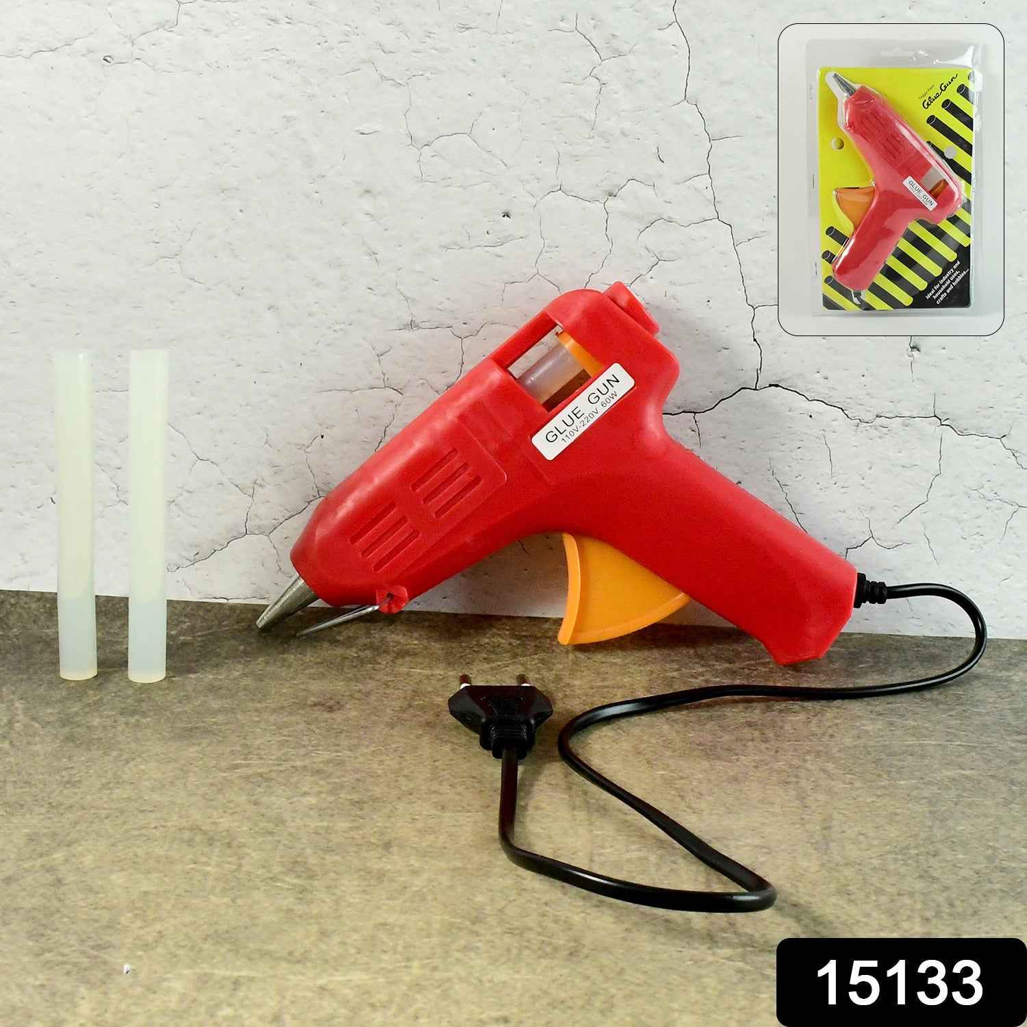 Close-up of the hot melt glue gun's ergonomic handle and trigger.