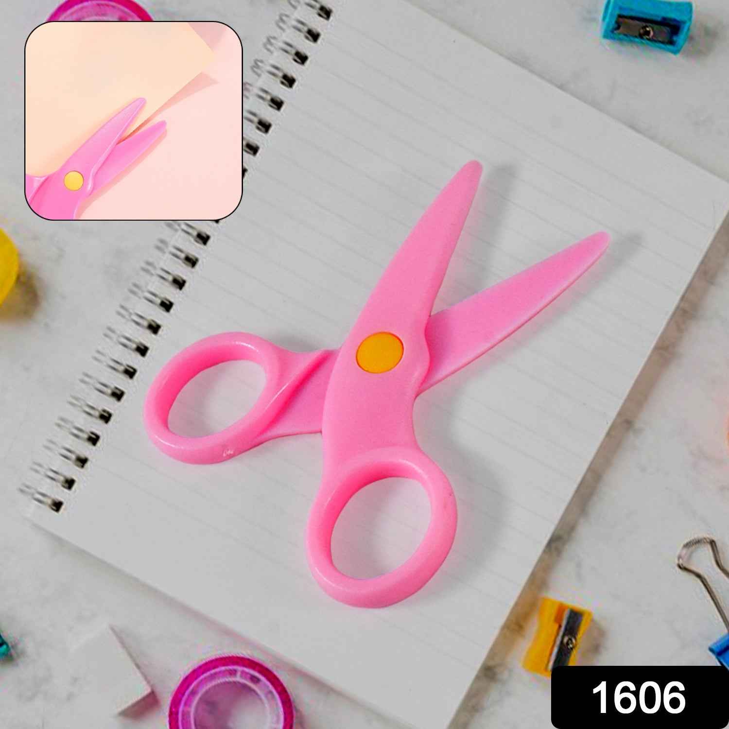 Close-up of the rounded tips on the child-safe plastic scissors, ensuring safety.
